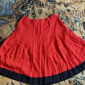 Vintage 80s red and black trim skirt. Knee length zipper closure with top button